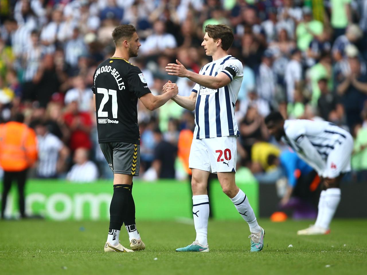 Adam Reach and Taylor Harwood-Bellis embrace after the full-time whistle at The Hawthorns 
