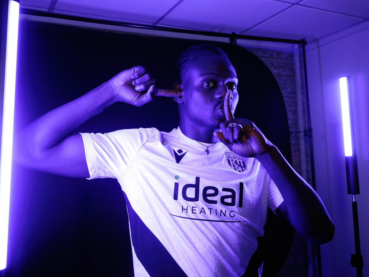 Ousmane Diakité posing for the camera inside a TV studio 