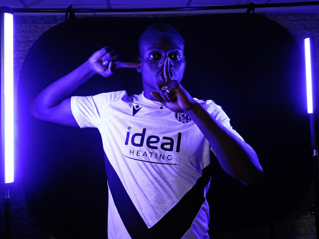 Ousmane Diakité posing for the camera inside a TV studio 