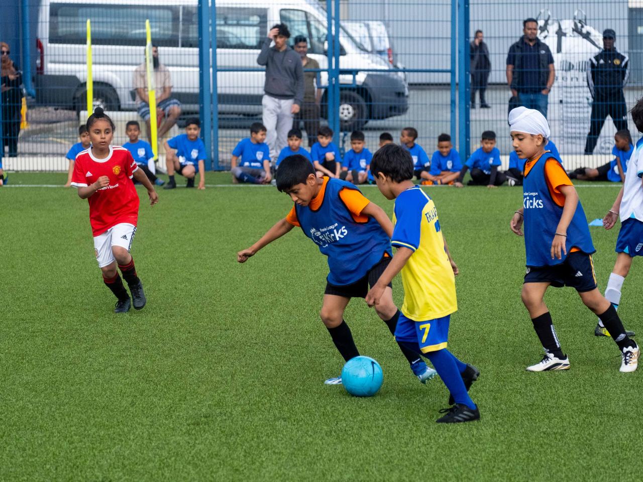 Participants at our South Asian Emerging Talent Festival compete for the ball whilst playing on the Academy pitch.