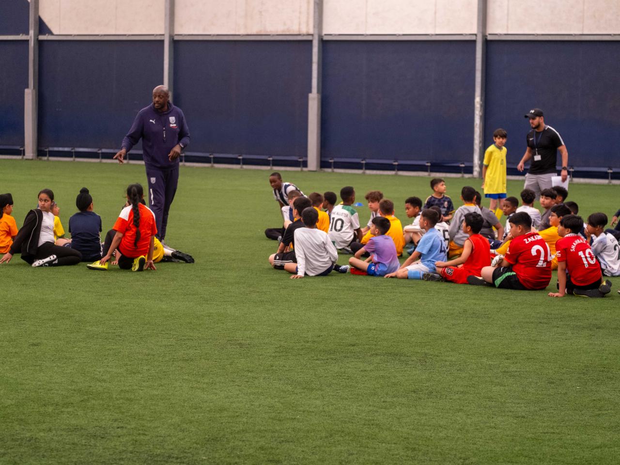 Participants at our South Asian Emerging Talent Festival receive instructions from The Albion Foundation coaches whilst inside the Academy Dome.