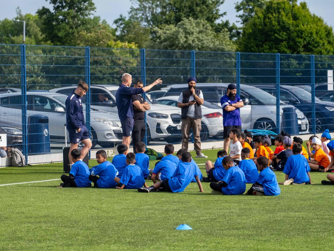 Participants at our South Asian Emerging Talent Festival receive instructions from The Albion Foundation coaches on the Academy pitch.