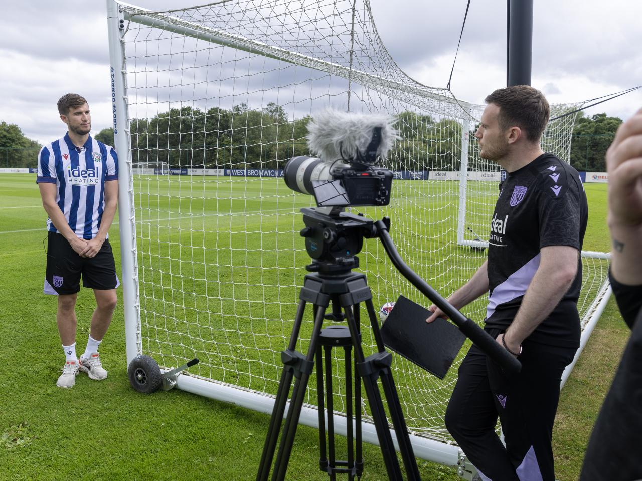 Paddy McNair is interviewed by WBA TV while stood up against a goal post 