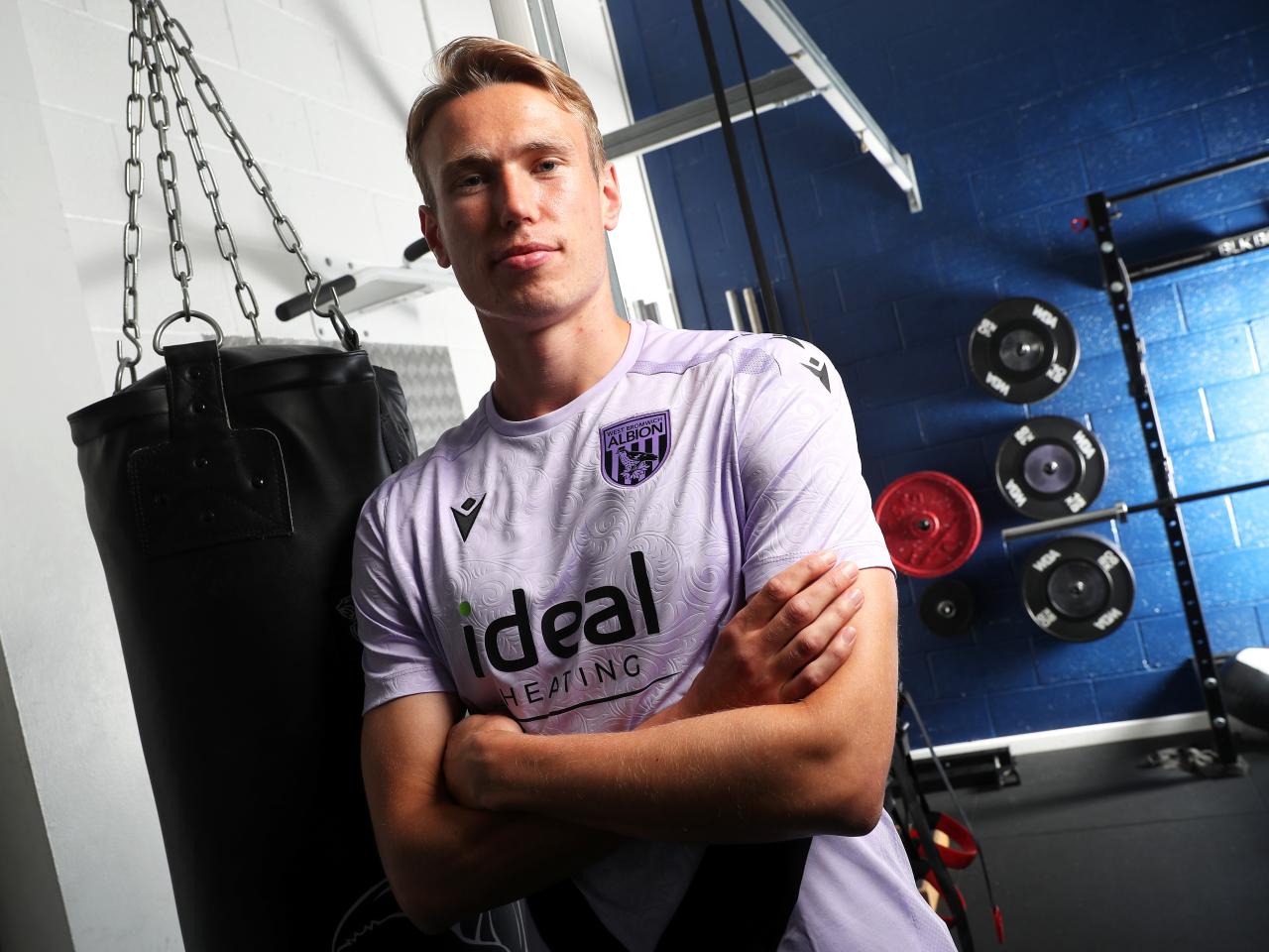 Torbjørn Heggem with his arms folded smiling at the camera in the gym