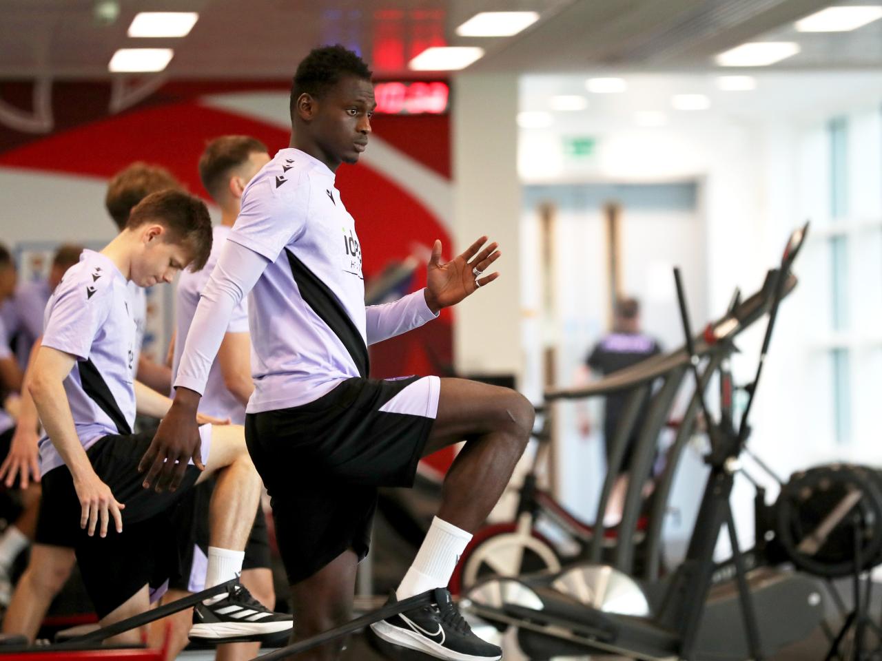 Ousmane Diakité stretching in the gym at St. George's Park