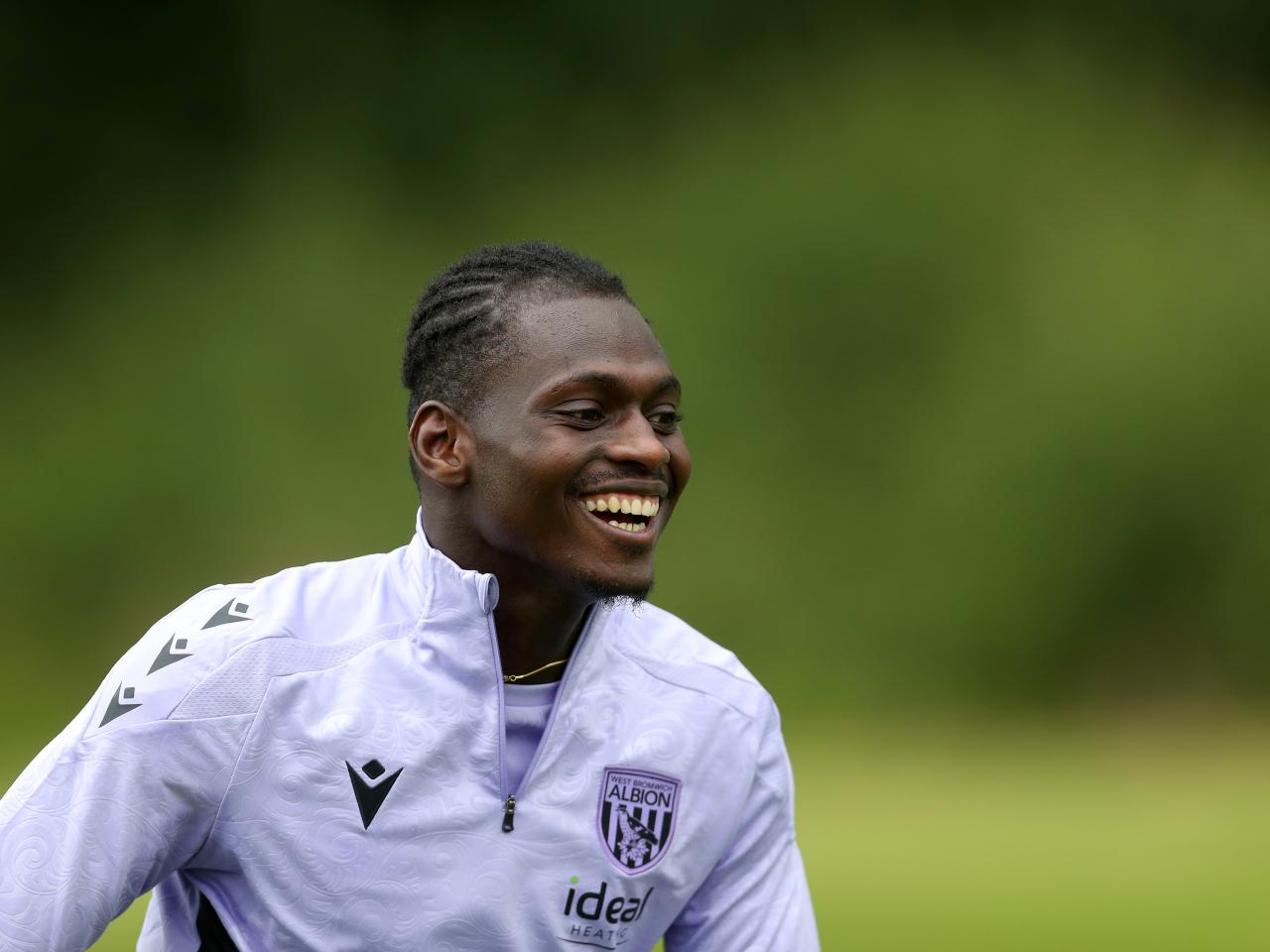 Ousmane Diakité smiling during a training session