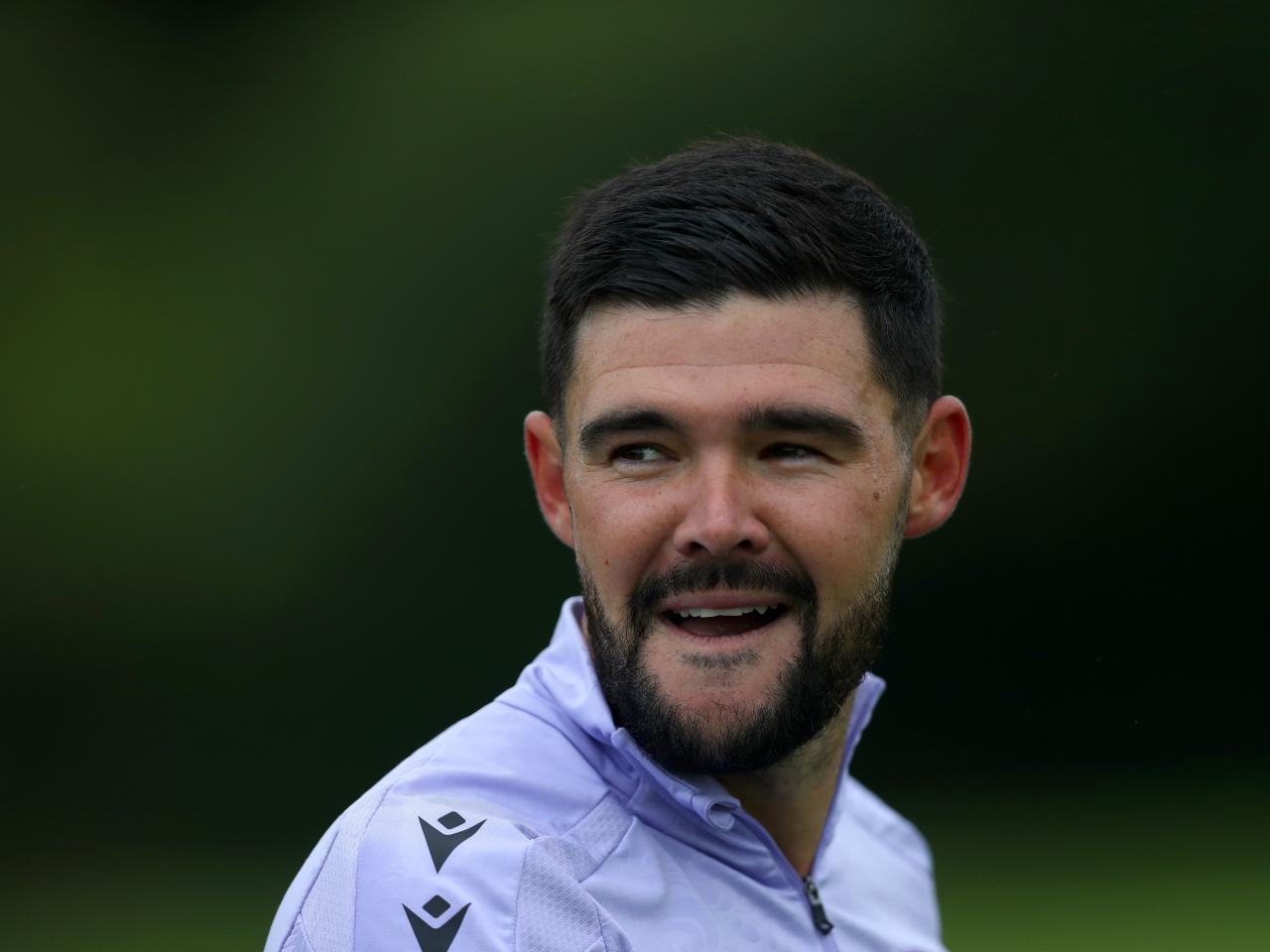 Alex Mowatt smiling during a training session 