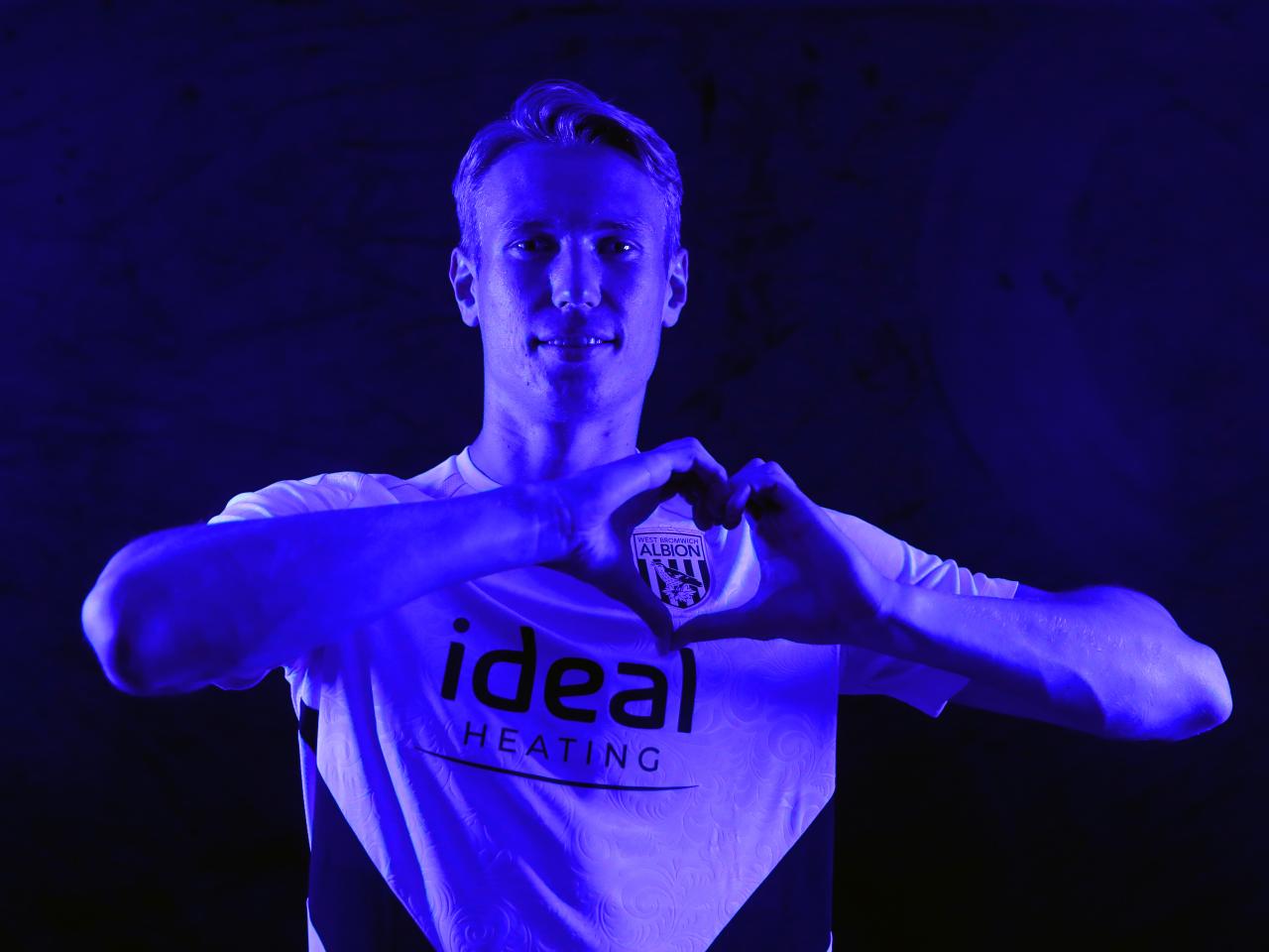 Torbjørn Heggem making a heart shape with his hands 