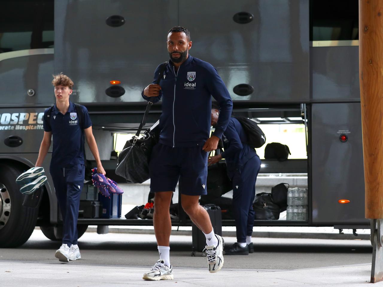 Kyle Bartley arriving at St. George's Park holding a bag