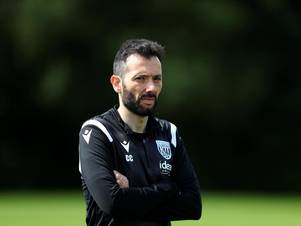 Carlos Corberán watching over a training session 
