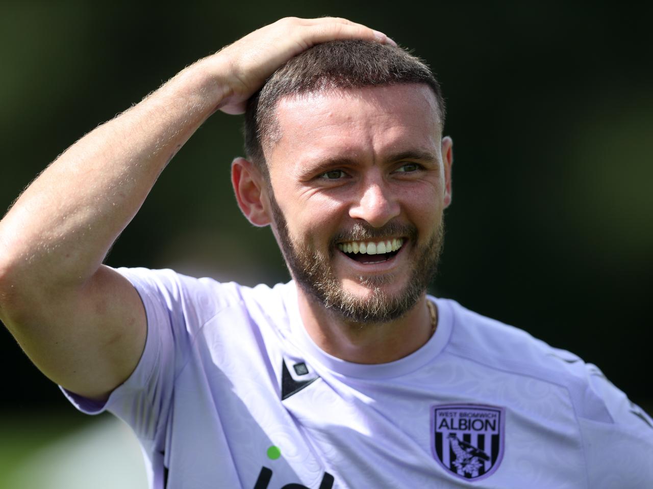 John Swift laughing during a training session