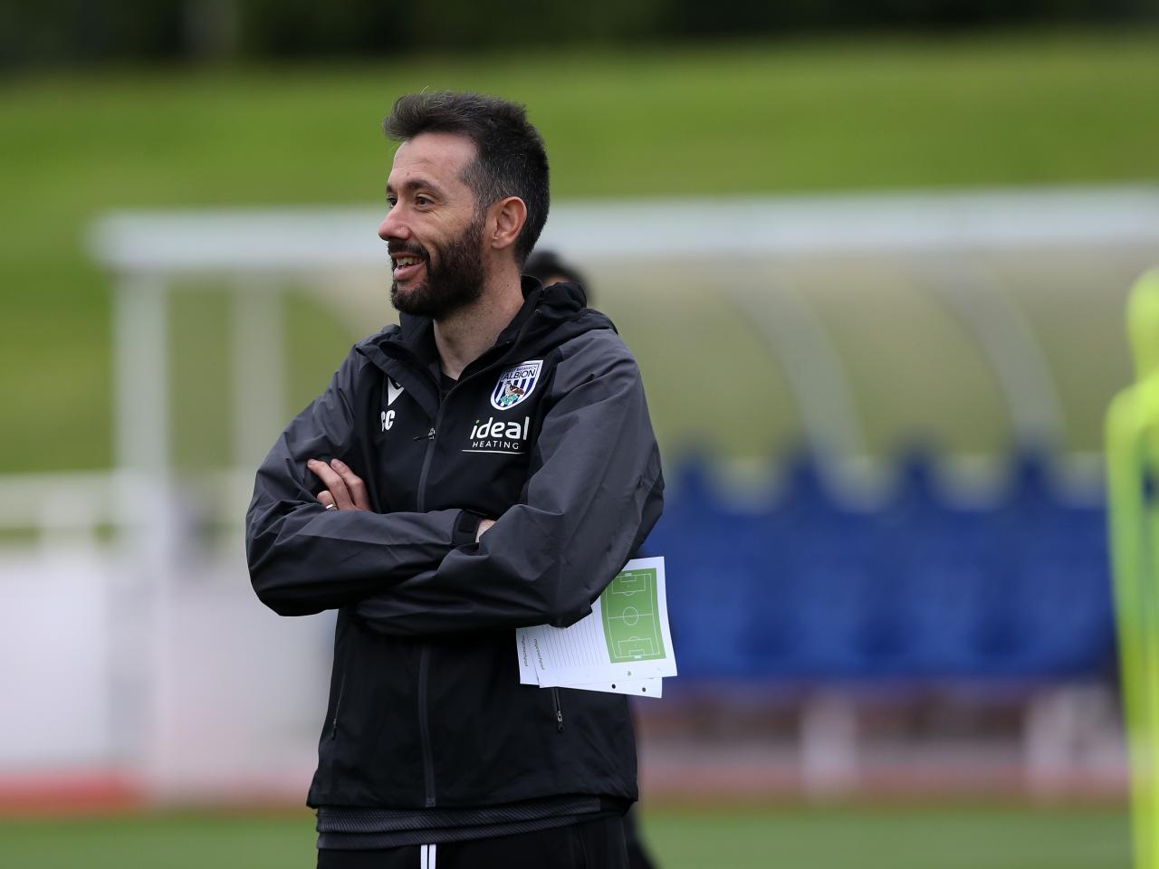 Carlos Corberán out on the training pitch at St. George's Park