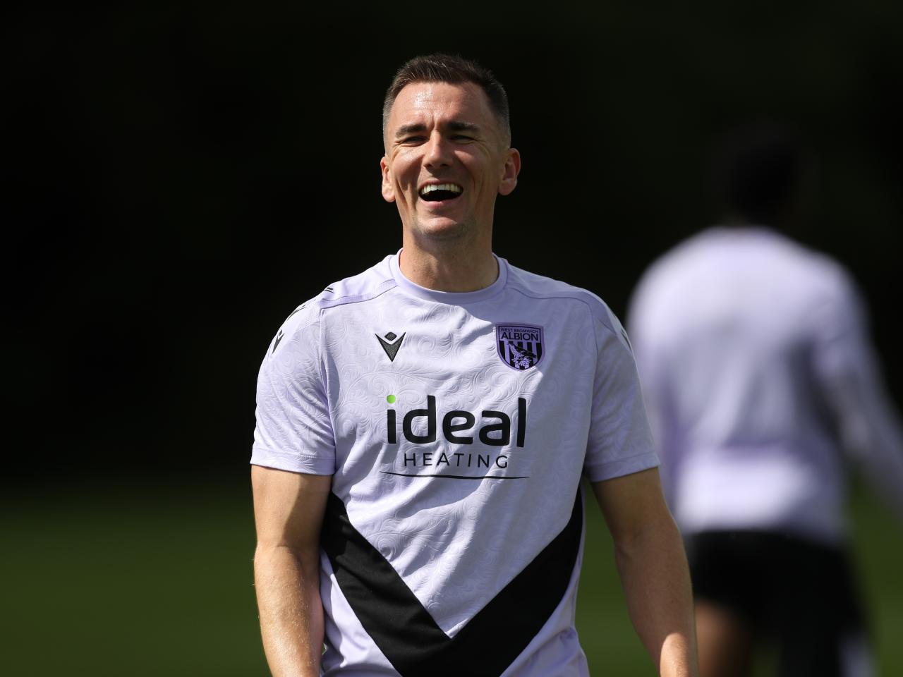 Jed Wallace laughing during a training session