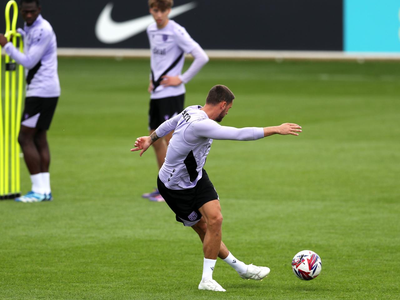 John Swift pulling off a rabona pass during training at St. George's Park