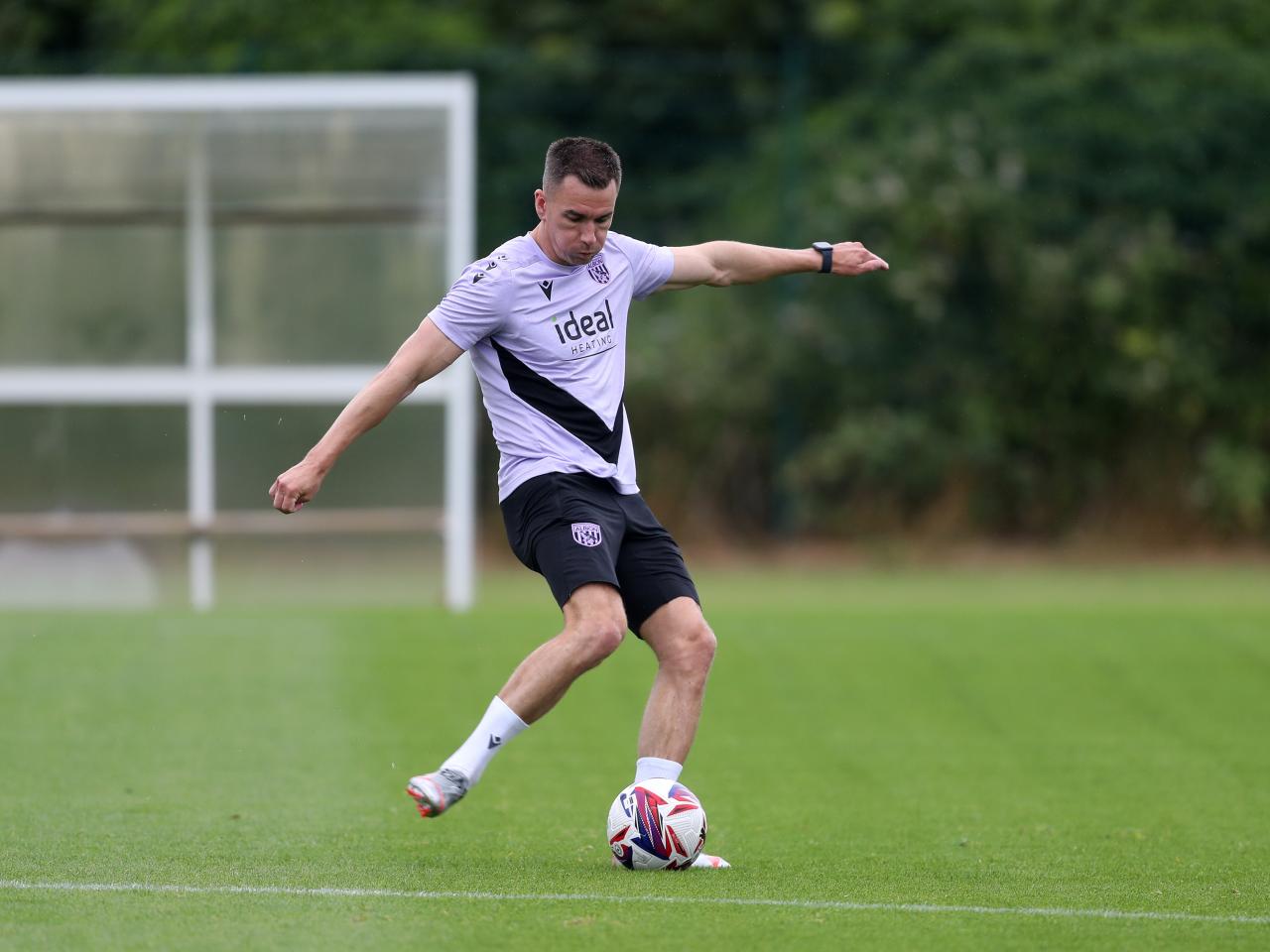 Jed Wallace striking the ball during a training session 
