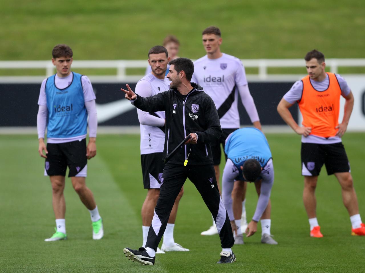 Coach Jorge Alarcon out on the training pitch at St. George's Park giving instructions to players