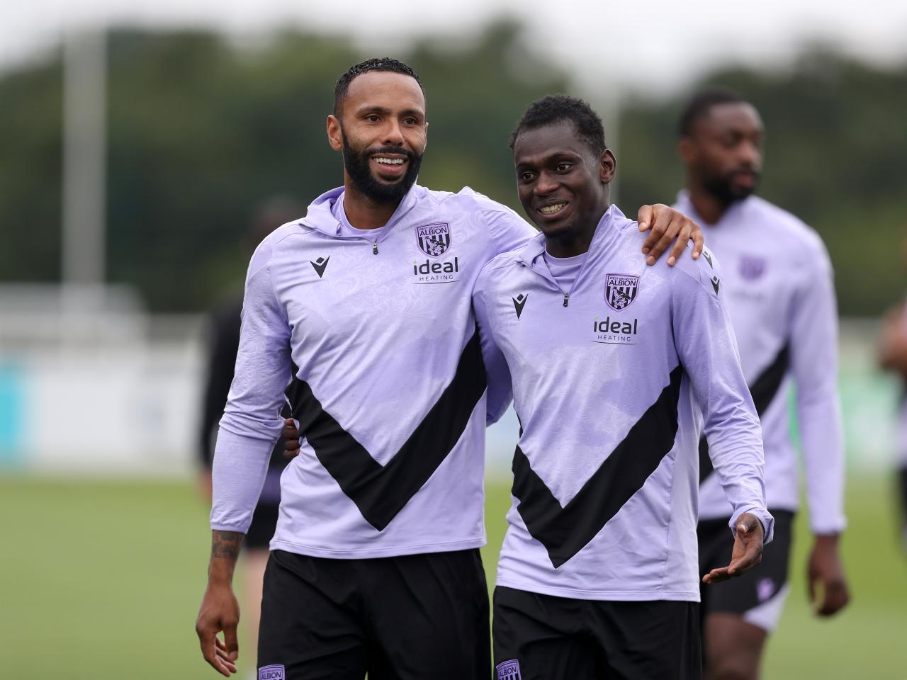 Kyle Bartley and Ousmane Diakité smiling during a training session at St. George's Park