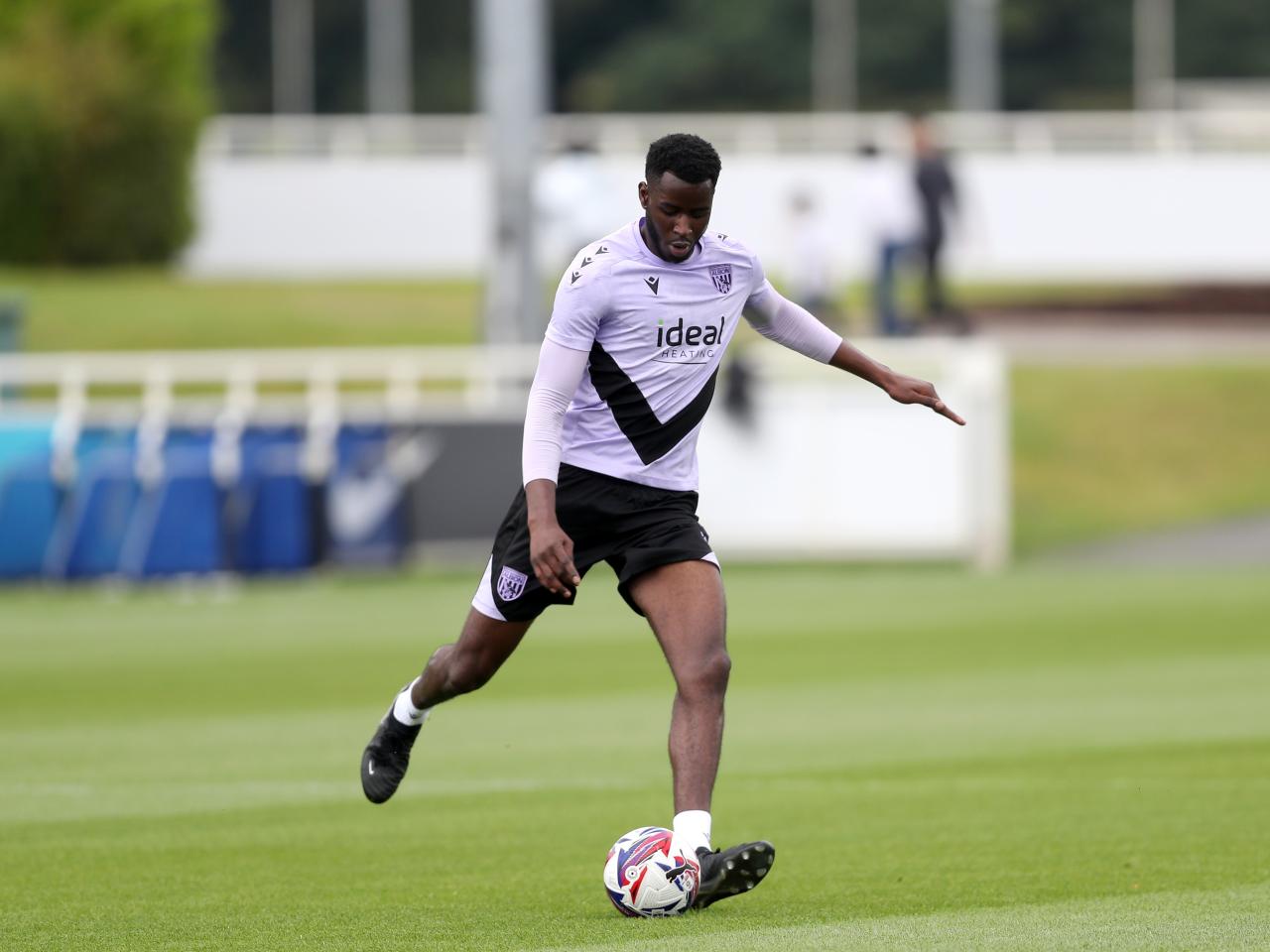 Mo Faal on the ball during training at St. George's Park