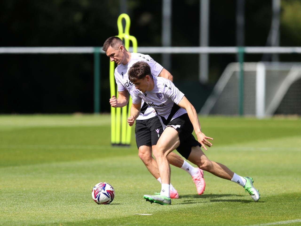 Tom Fellows and Jed Wallace fighting for the ball during training 