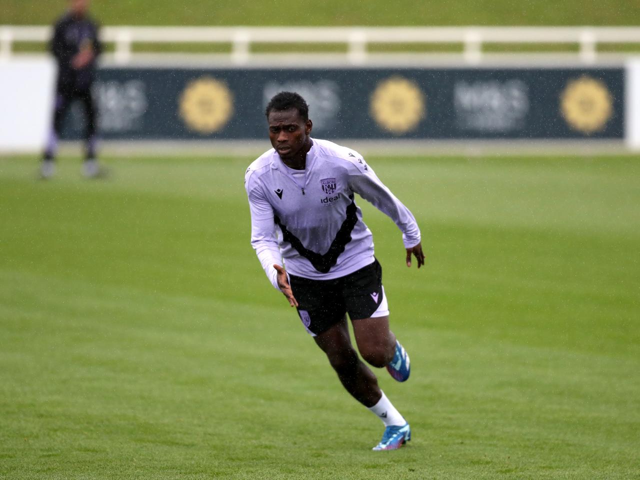 Ousmane Diakité running forwards during a training session at St. George's Park