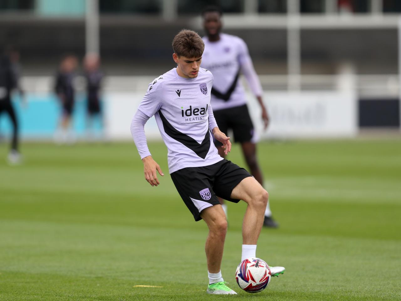 Tom Fellows on the ball during training at St. George's Park