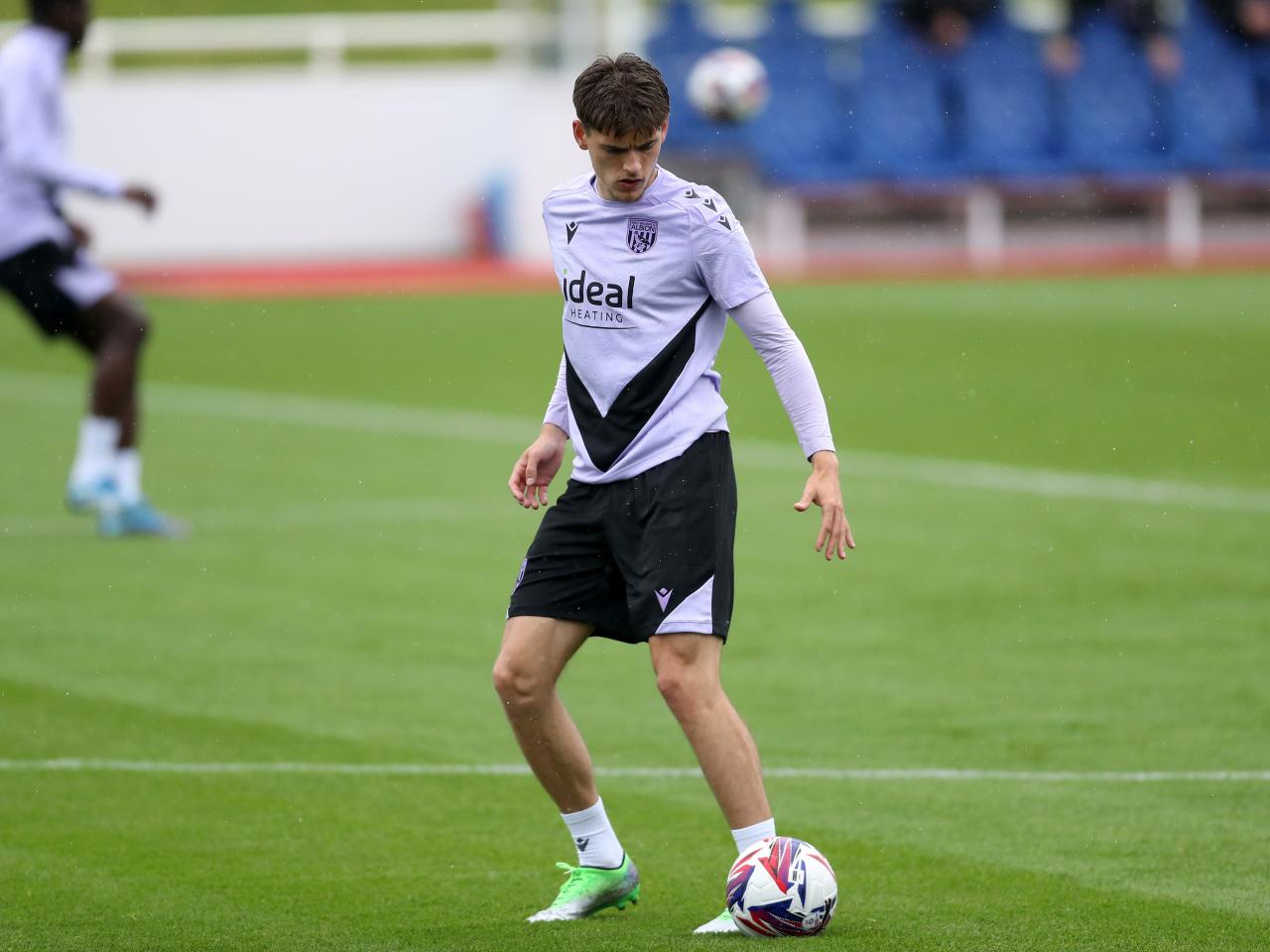 Tom Fellows on the ball during a training session at St. George's Park