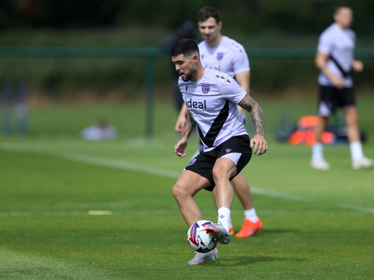 Alex Mowatt on the ball during training 