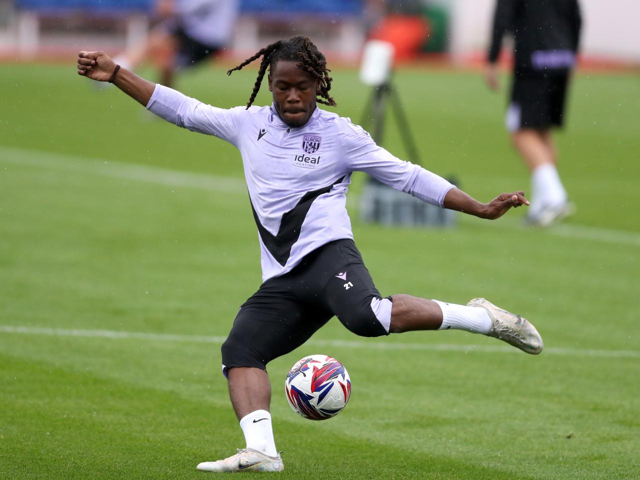 Brandon Thomas-Asante striking the ball during a training session at St. George's Park
