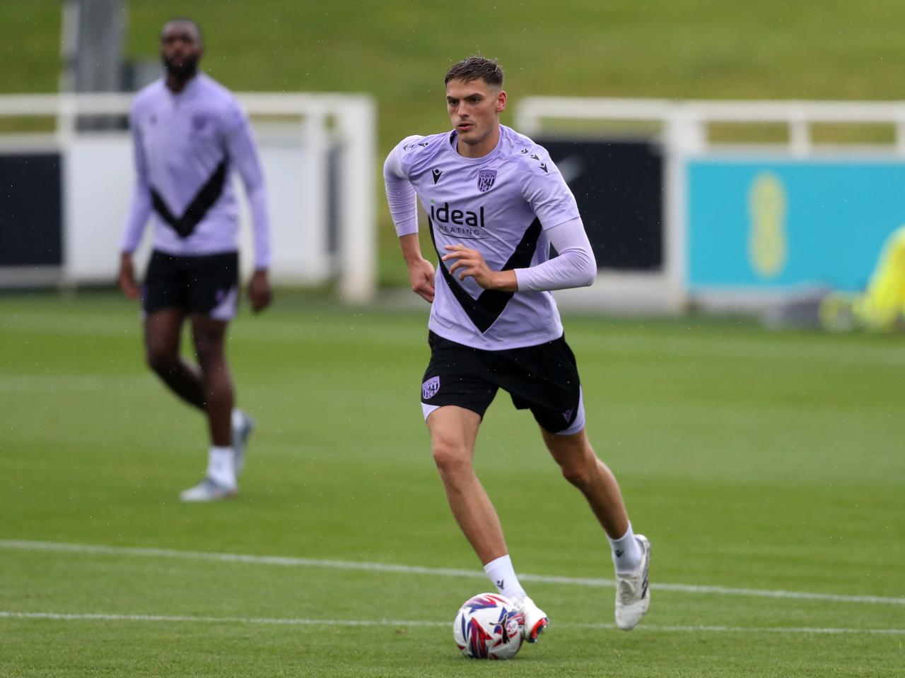 Caleb Taylor on the ball during a training session at St. George's Park
