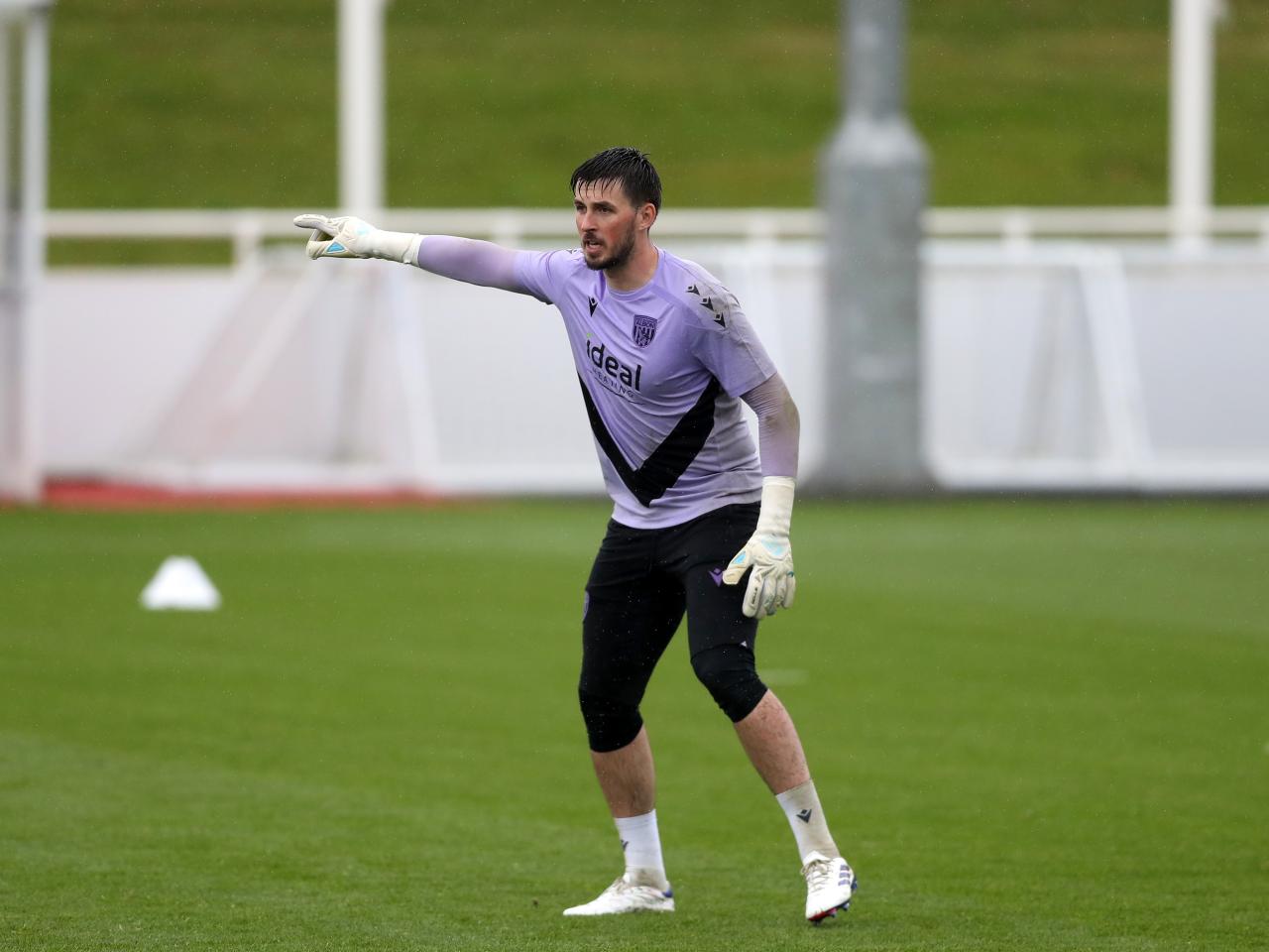 Joe Wildsmith pointing to his right during a training session at St. George's Park