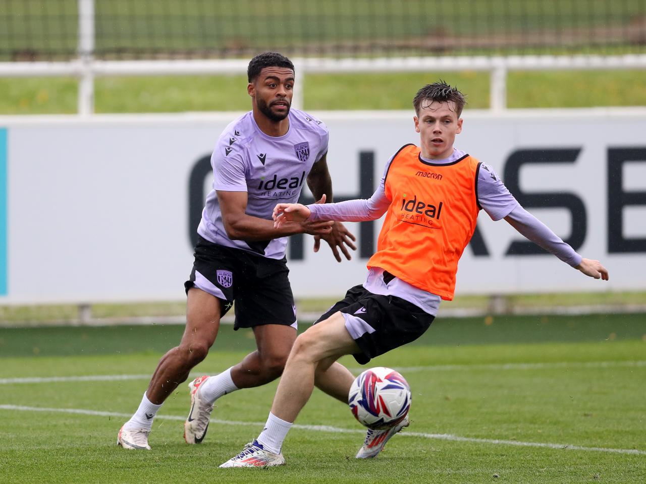 Darnell Furlong and Fenton Heard close to the ball during a training session at St. George's Park