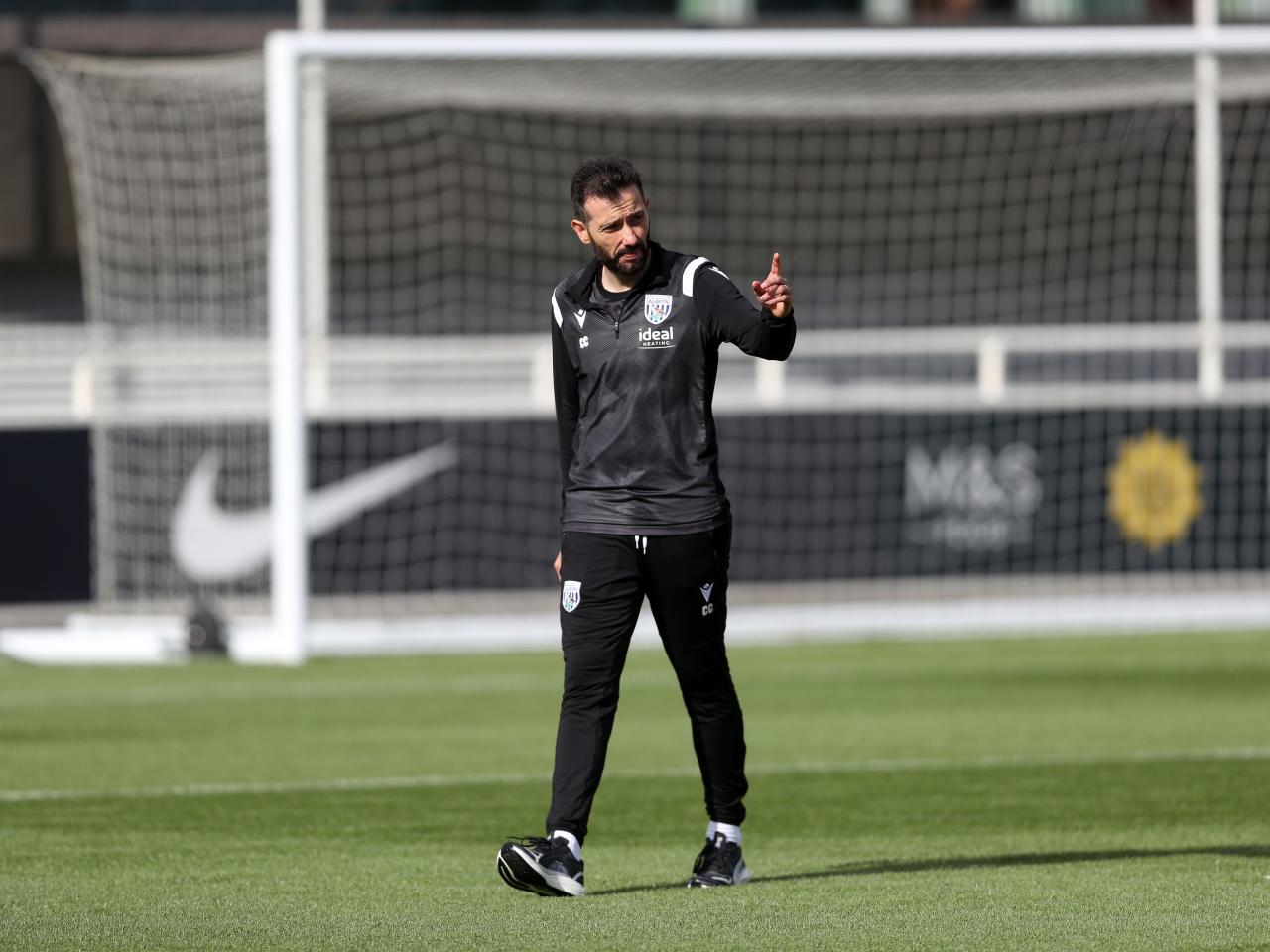 Carlos Corberán out on the training pitch at St. George's Park