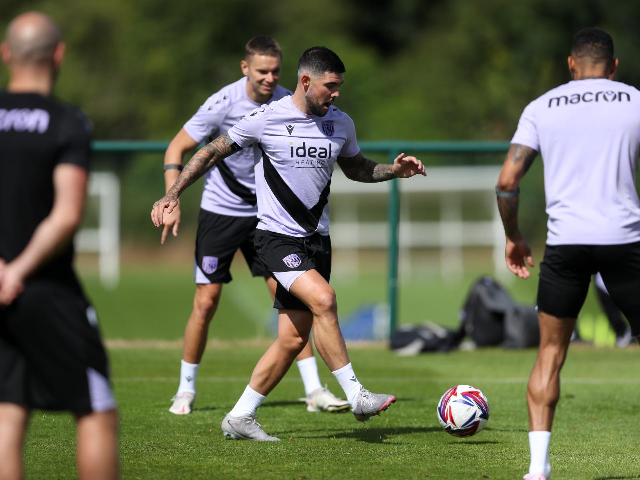 Alex Mowatt on the ball during training 