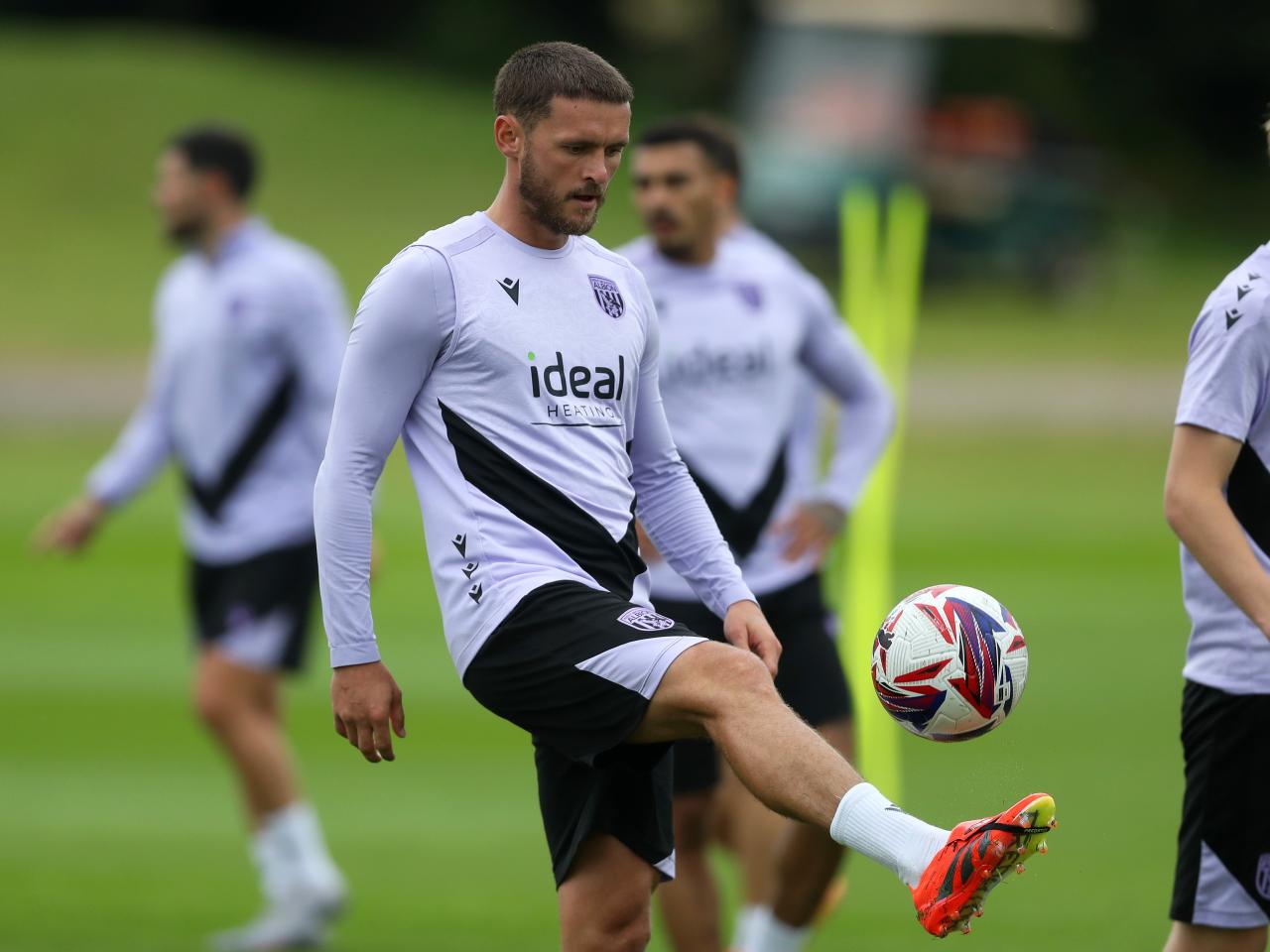 John Swift controlling a ball during a training session 