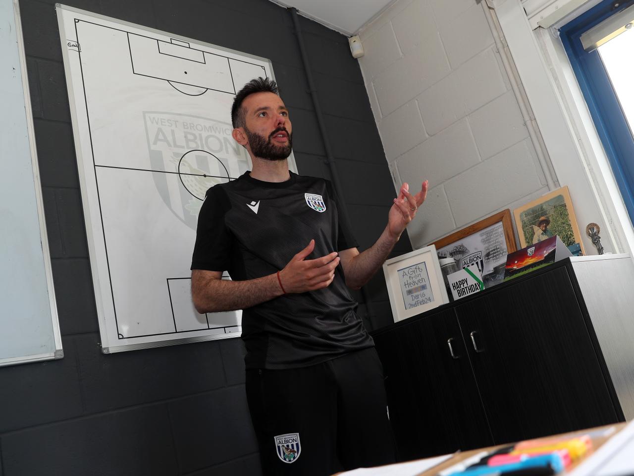 Carlos Corberán delivering info to his coaching staff in his office at the training ground 