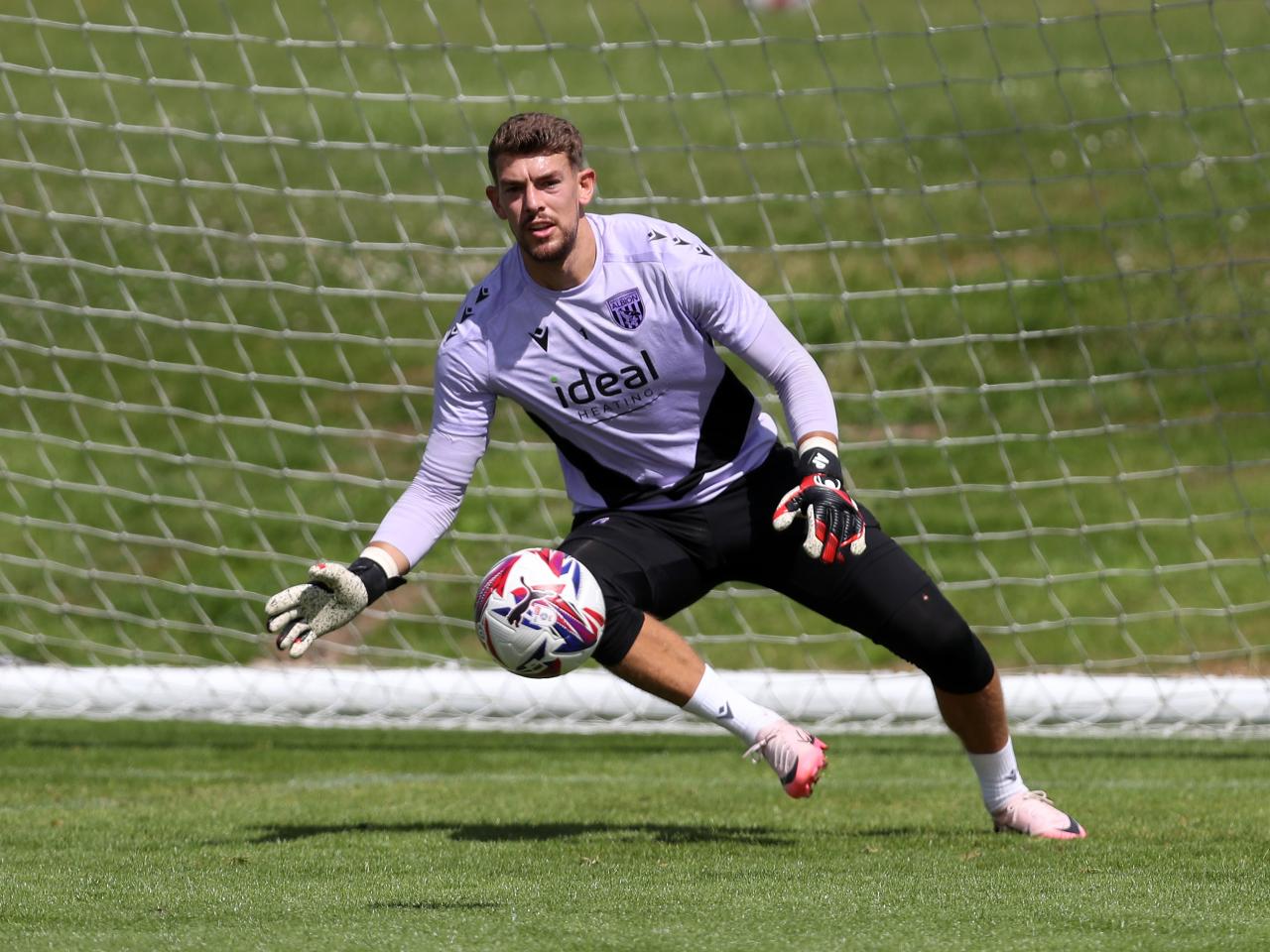 Alex Palmer diving for a ball in training 