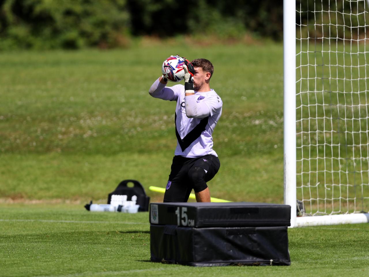 Alex Palmer catching a ball in training 