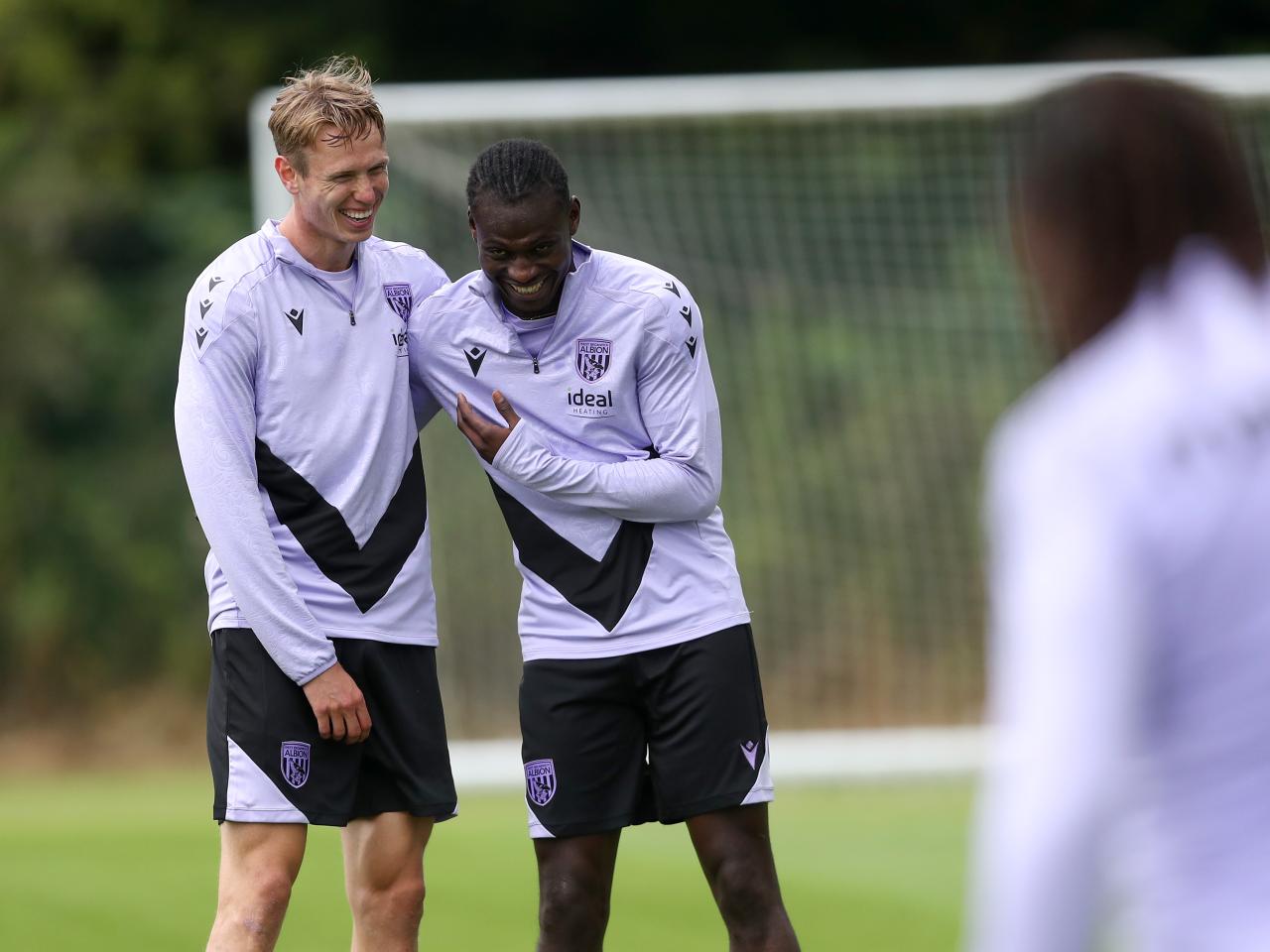 Torbjørn Heggem laughing with Ousmane Diakité during training 