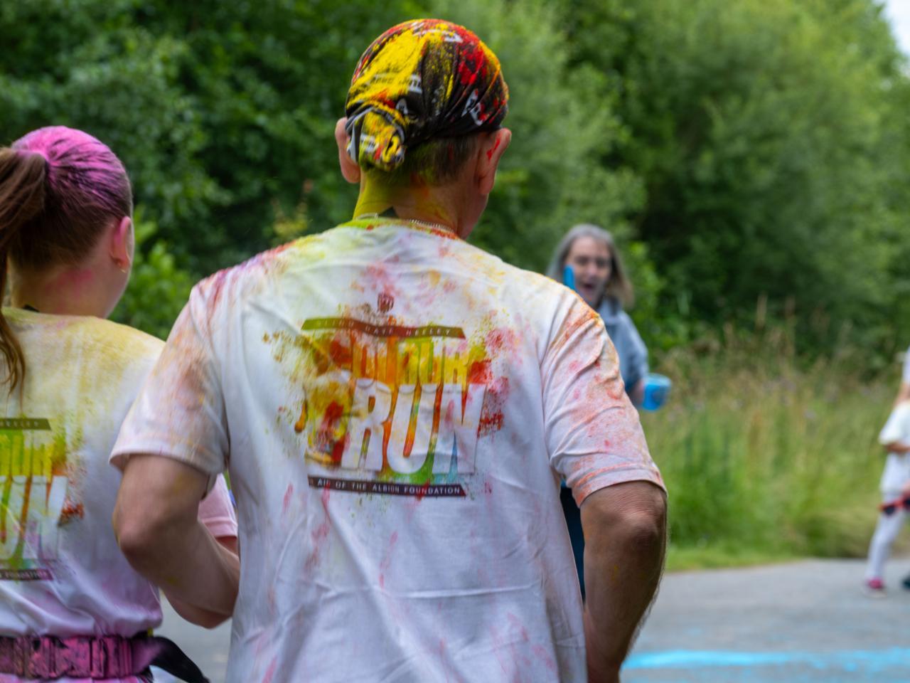 Back of runners, Dannie Heeley, and Blind Dave Heeley, heading towards a colour station.
