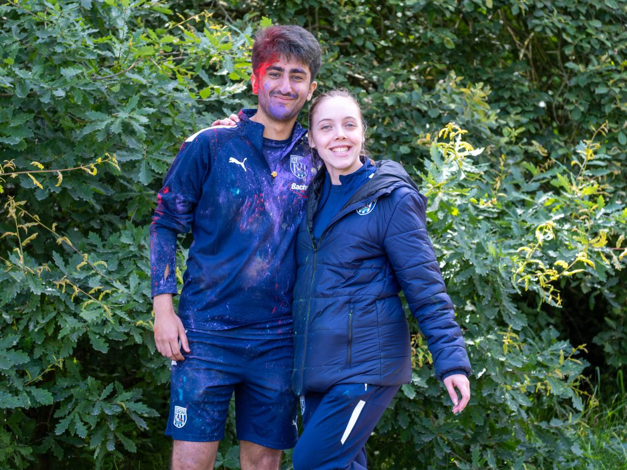 Two Foundation staff member posing for a photo at another colour station.