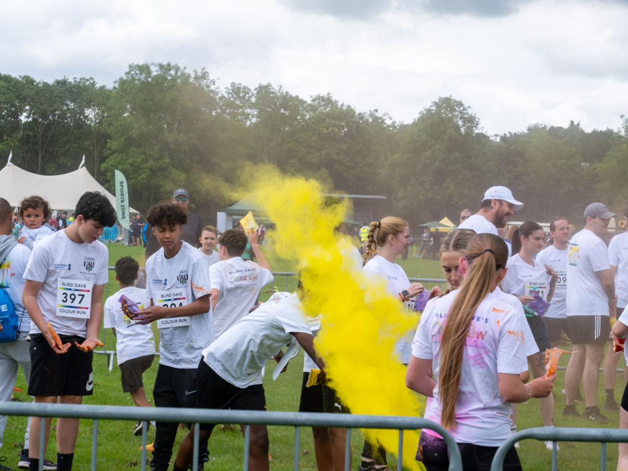 Burst of yellow paint being thrown.