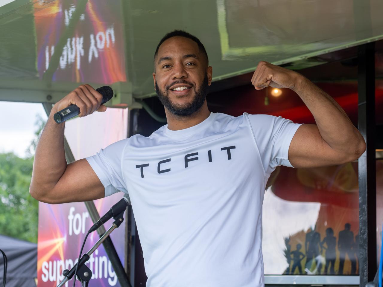 Tony Clark (TC Fit) flexing muscles.