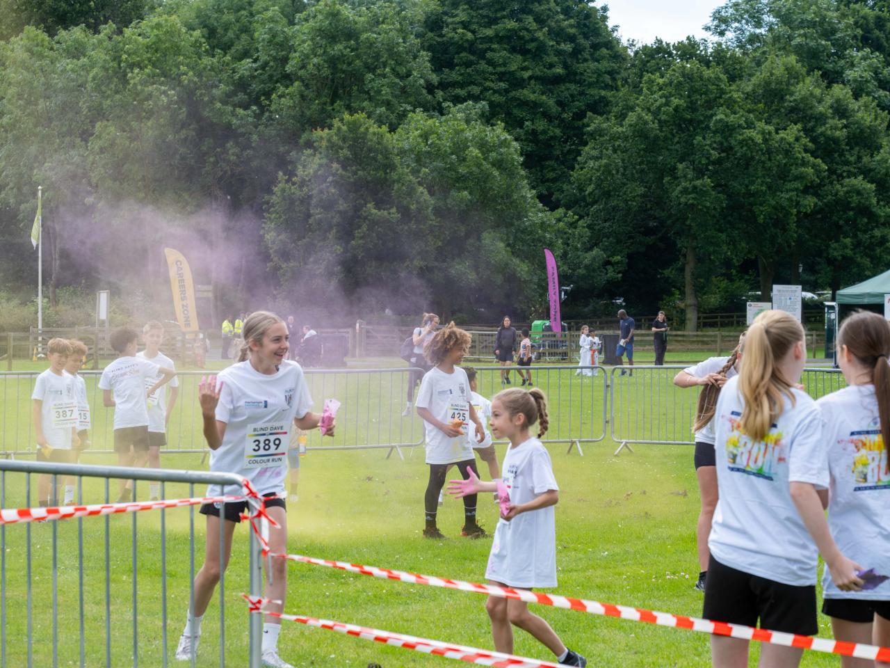 Participants throwing coloured powder.