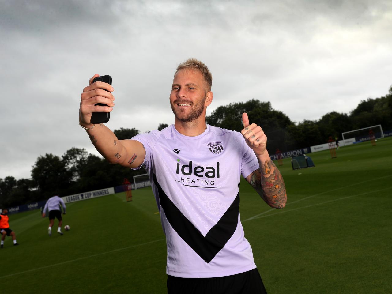 Uroš Račić takes a selfie out on a training pitch 