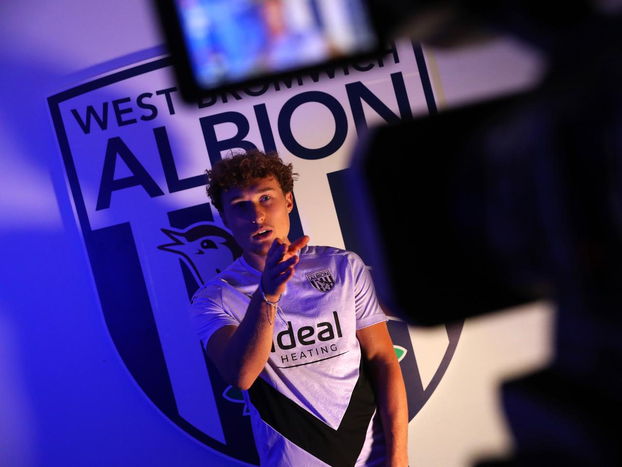 Callum Styles being interviewed in front of a WBA badge 