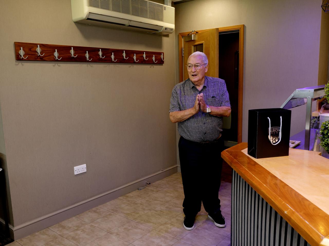 Graham Williams walks into the Graham Williams Suite at The Hawthorns