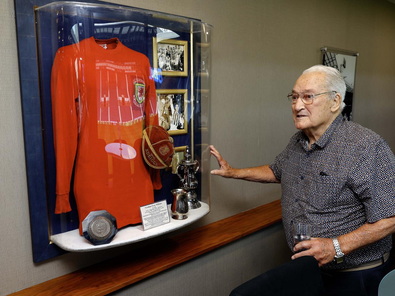 Graham Williams looking at a picture on the wall at The Hawthorns 
