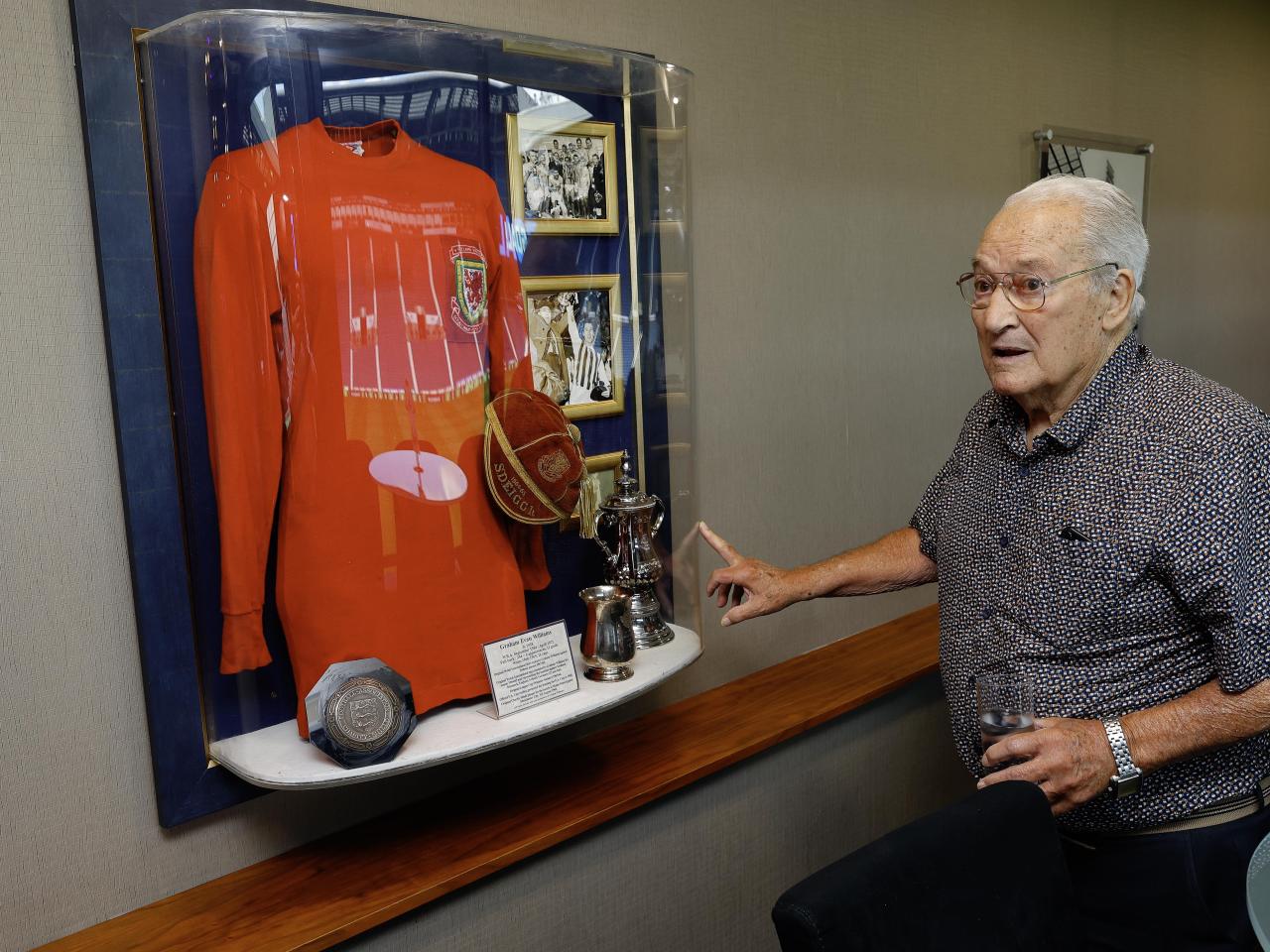 Graham Williams looking at a picture on the wall at The Hawthorns 