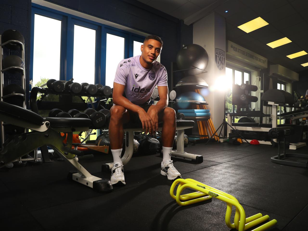 Lewis Dobbin looking at the camera while sat in the gym 