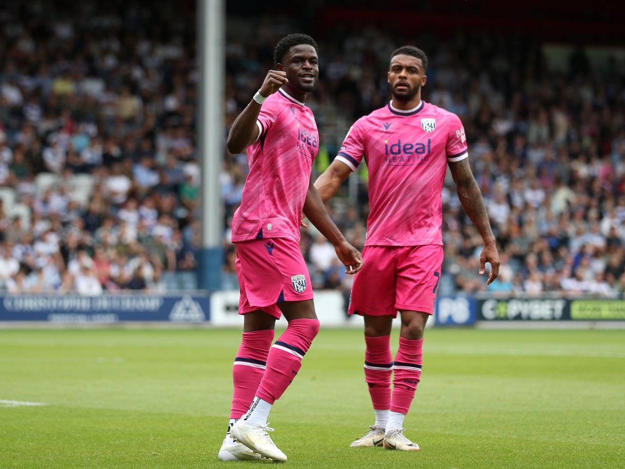 Josh Maja celebrates scoring his first goal at QPR with Darnell Furlong 